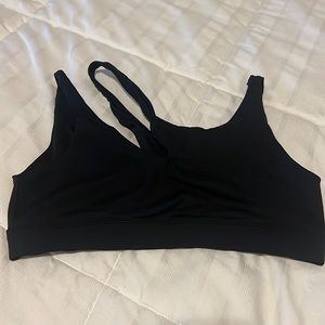 Black crossover ALO Yoga sports bra